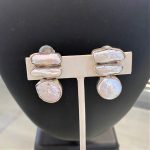 clip on earrings in sterling silver with two barr pearls on top and one round coin pearl below them
