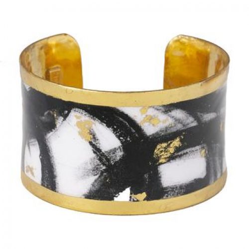 1.5 inch wide cuff bracelet with gold leaf and enamel finish and black and white paintbrush design