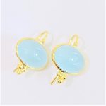 Oval Cabochon aquamarine hanging earringsin 14 k yellow with 3 gold ball accents on the bottom and ear wires
