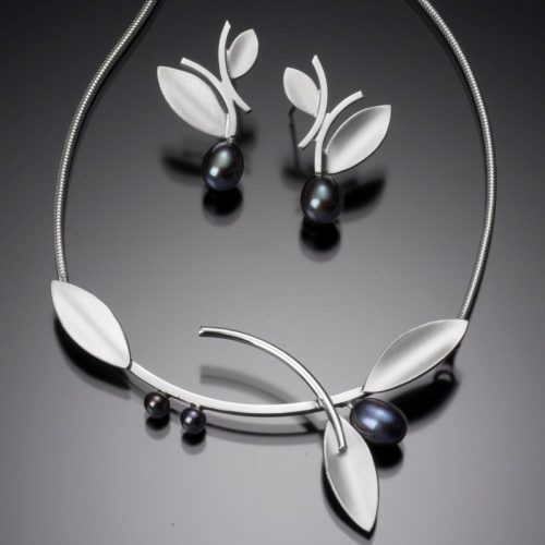 handcrafted sterling silver alternating leaf with 3 black pearls centerpiece suspended on a 16" snake chain shown with matching post earrings
