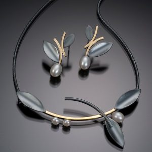 handcrafted necklace in oxidized sterling silver, 18k gold overlay and white freshwater pearls; alternating leaf and 3 white pearl centrpiece with 18k yellow gold overlau on connecting bar, all suspended from snake chain for 16 inches length