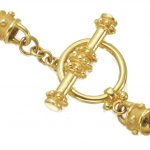 14 k yellow gold removaable screw in toggle with Capri style gold ball accents around connector ends and on toggle bar