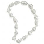 an 18 inch strand of white baroque pearls shown by itself, to be paired with a removable toggle