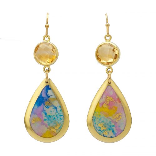 Hanging earrings on gold earwire suspending a small round faceted citrine rimmed in gold and then a small sold teardrop with rainbow palette watercolor swashes and gold leaf rim