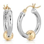 Silver round hoop earrings with a fixed gold ball at bootom of hoop and gold post and findings