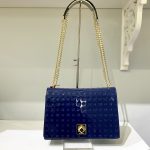 cobalt blue patent leather handbag with gold hardware and chain strap